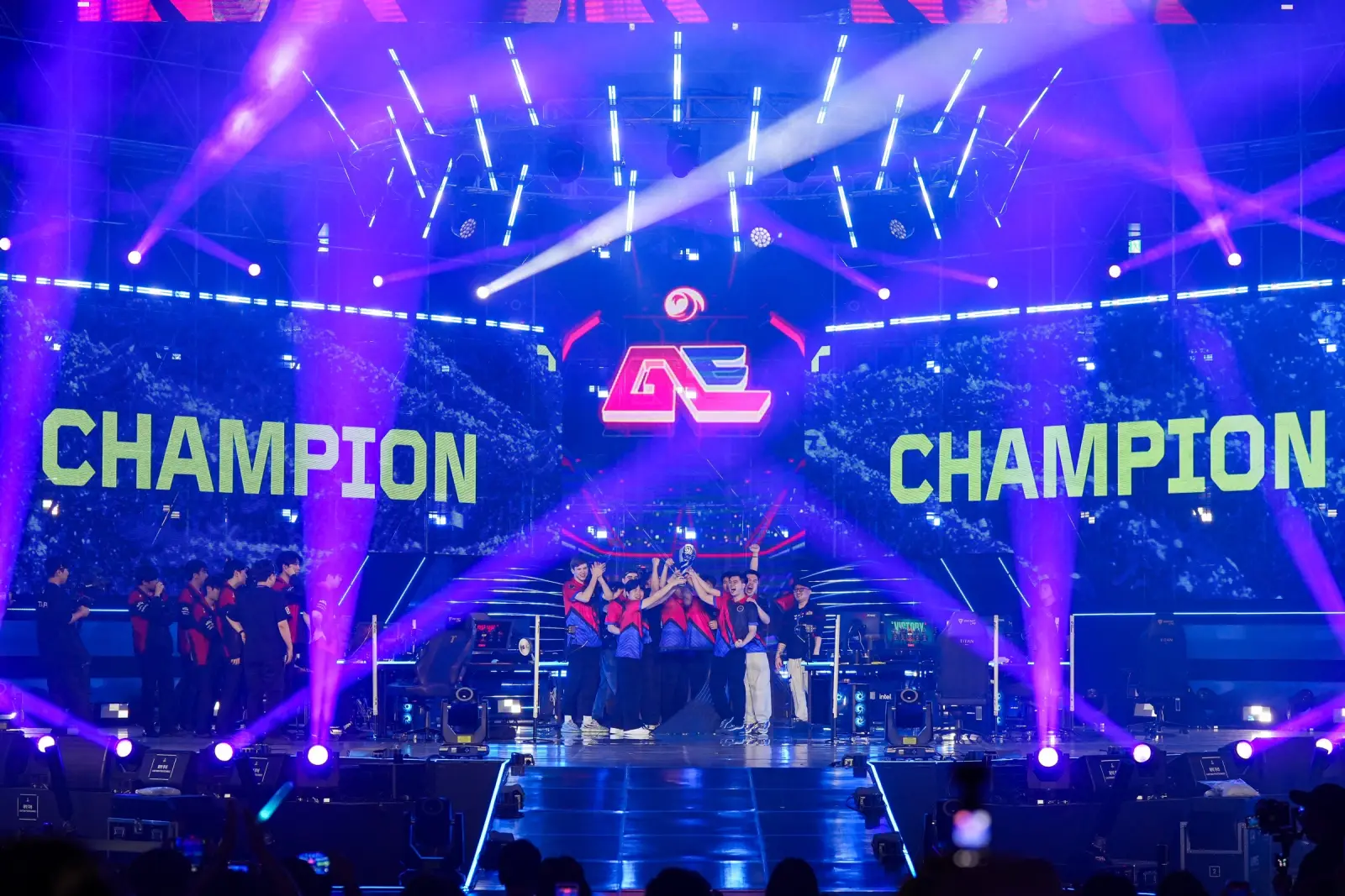 Global Esports on stage in Busan as the screens read CHAMPION
