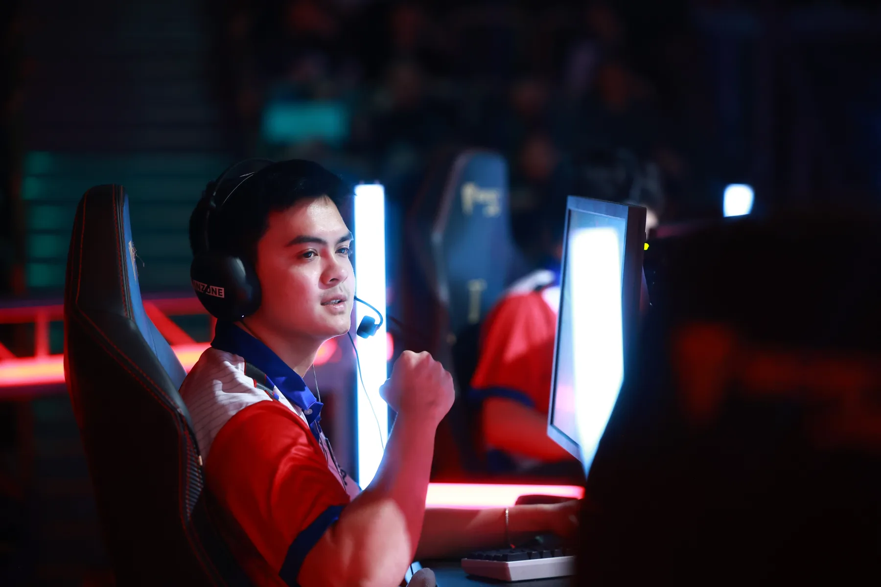 Global Esports player celebrating with a fist pump on stage